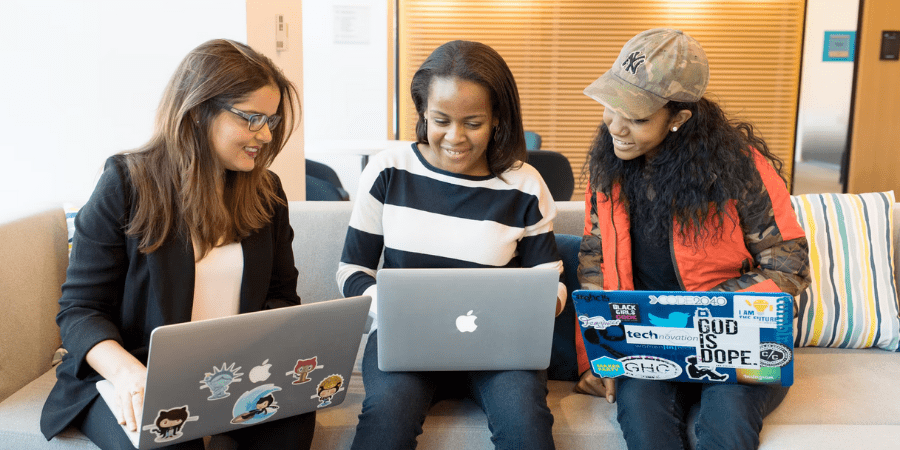 3 Women Sitting Down with Laptops